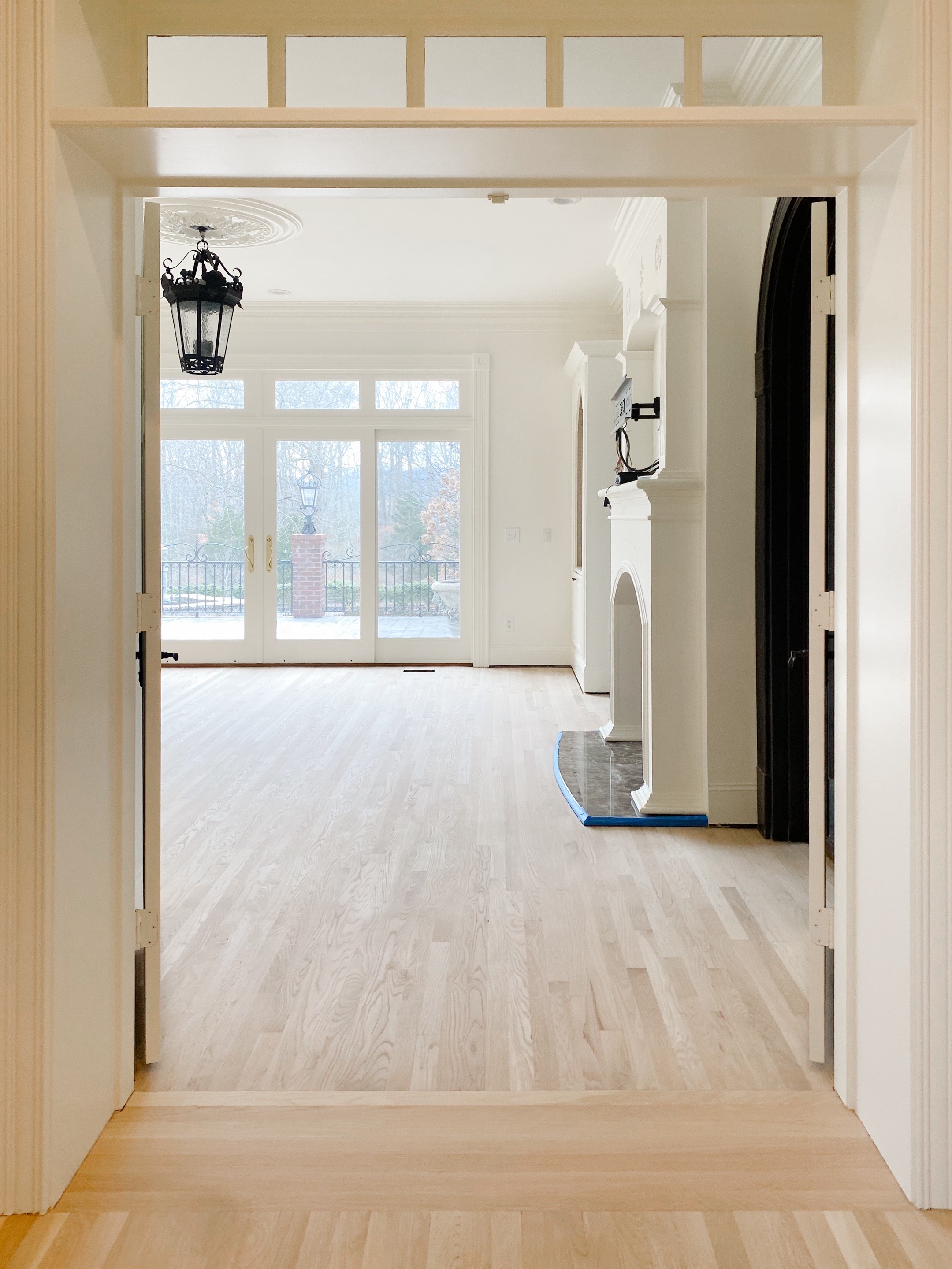 Light hardwood foyer with elegant interior